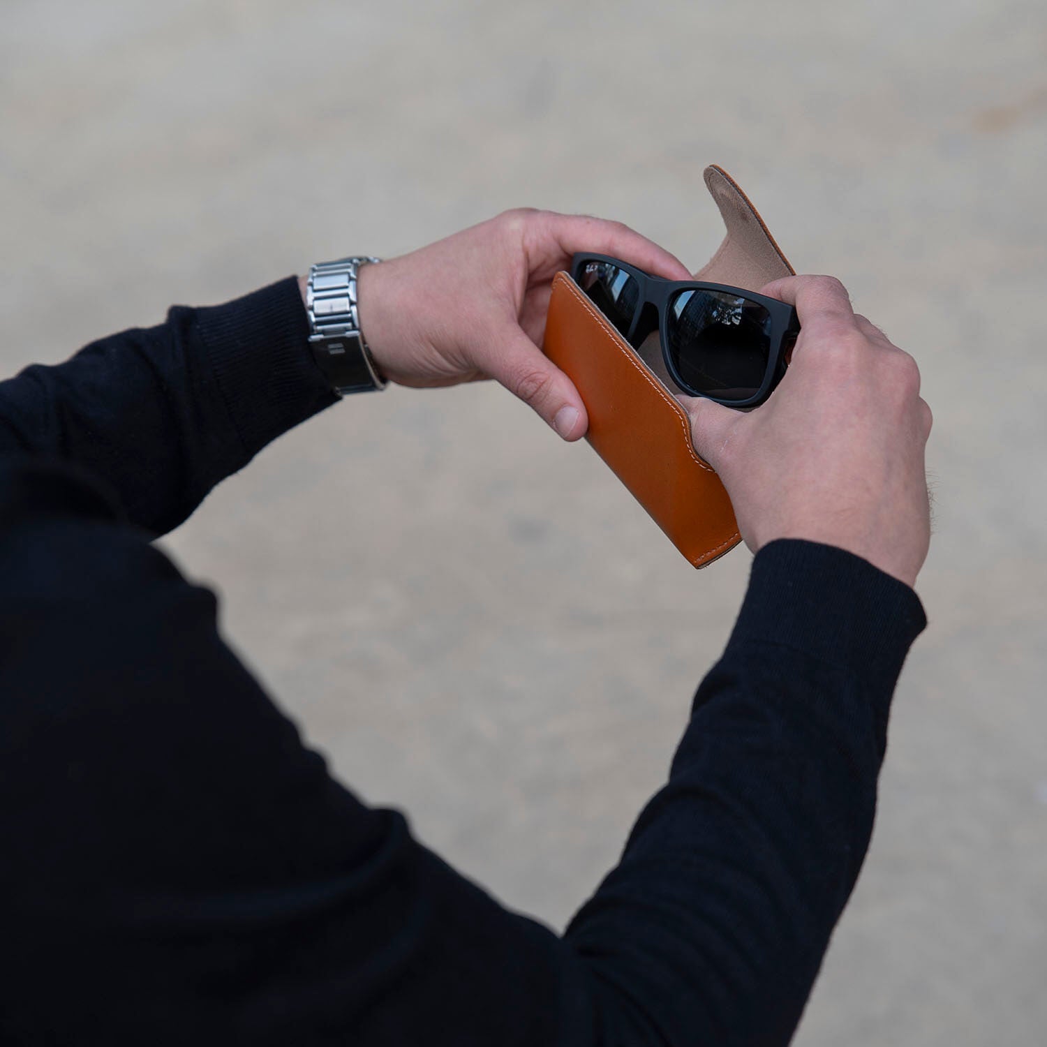 Medium brown leather sunglass case with wrist strap from LEATHERE, designed for eyewear accessories and easy carrying.