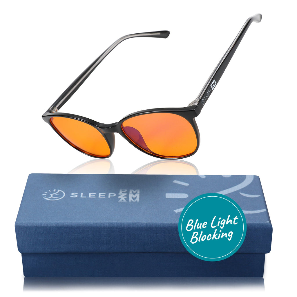 Blue light blocking glasses for kids in black by Sleep ZM, featuring orange accents and a comfortable fit for nighttime screen use.