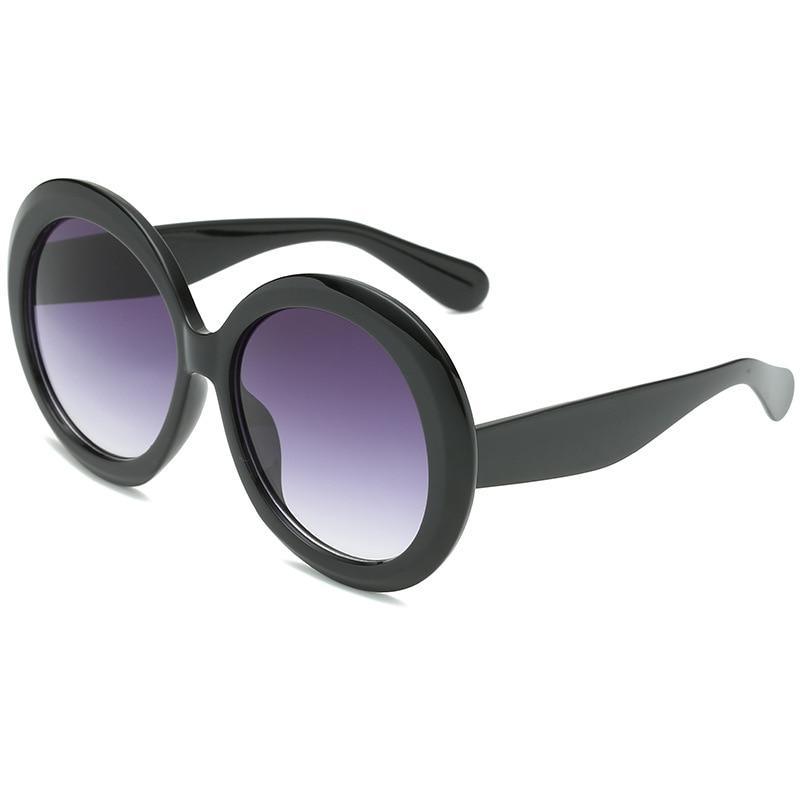 Stevvex oversized oval vintage UV400 sunglasses with elegant design and dark tinted lenses.