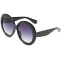 Stevvex oversized oval vintage UV400 sunglasses with elegant design and dark tinted lenses.