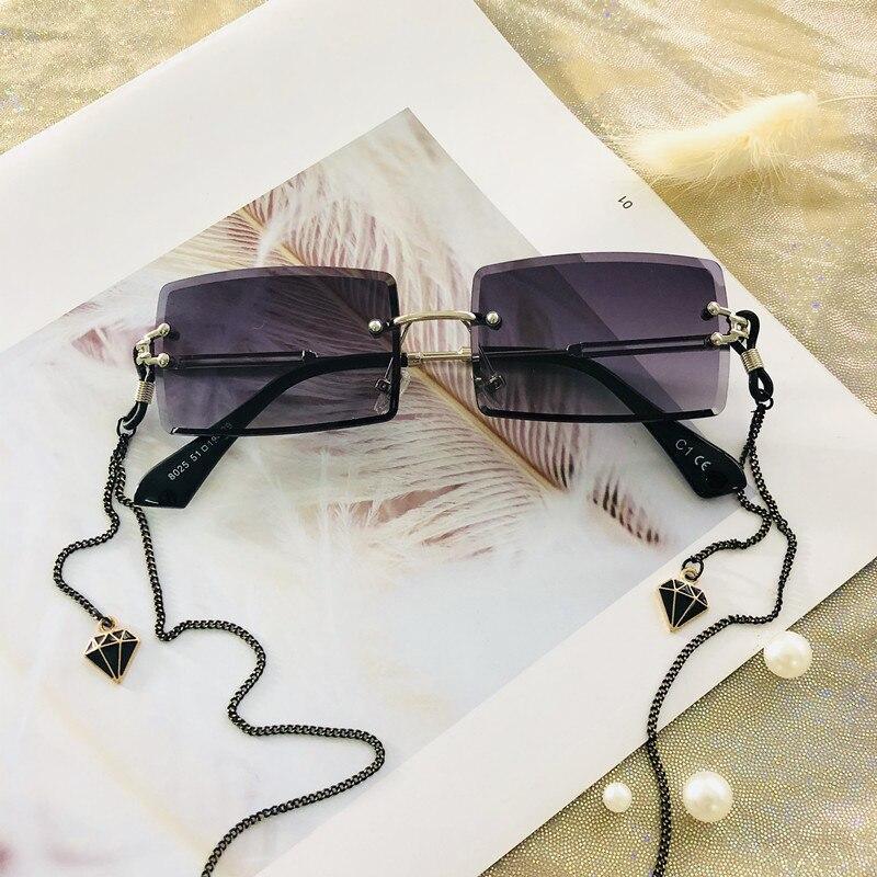 Stevvex rimless rectangle UV400 sunglasses with dark tinted lenses and slim metal frames, stylish and protective eyewear.