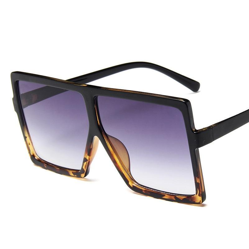 Oversized modern luxury square women's UV400 sunglasses by Stevvex with bold black frames and dark tinted lenses.