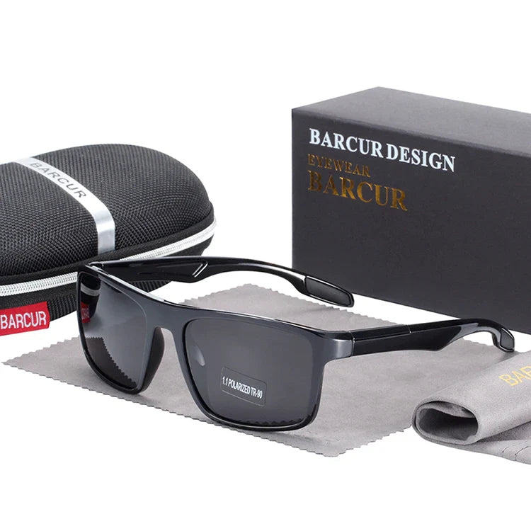 Stevvex BARCUR TR90 ultralight polarized UV400 sunglasses with clear lenses and sleek black frames, outdoors on a sunny day.