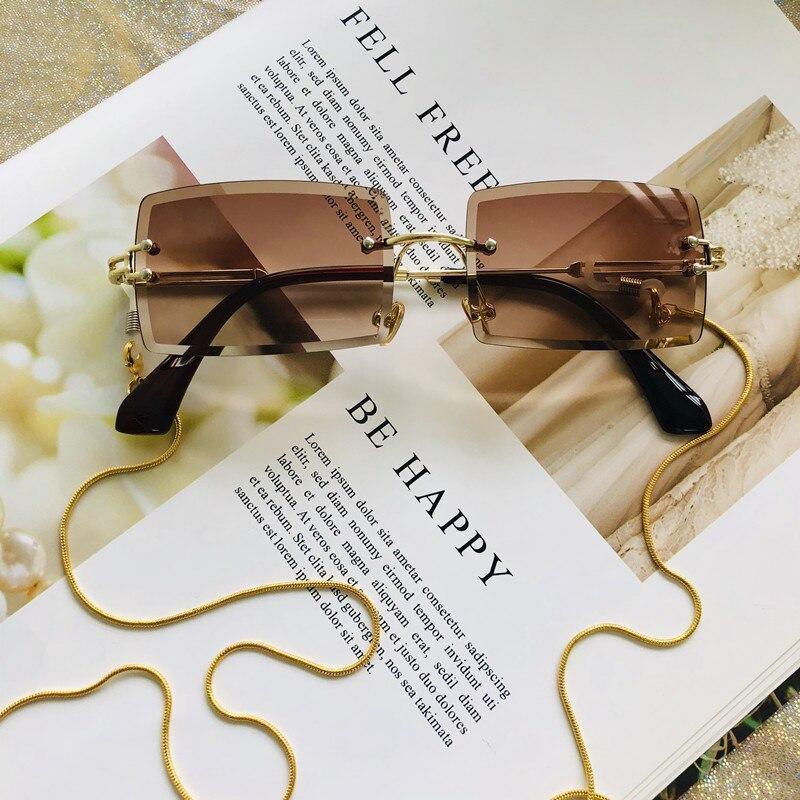 Stevvex fashion rimless rectangle UV400 sunglasses with black frames and dark lenses, stylish and lightweight for sunny days.