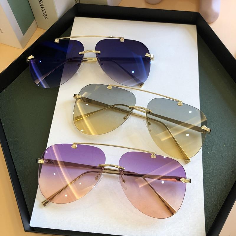 Stevvex metal rimless UV protected gradient sunglasses with sleek design and tinted lenses, perfect for stylish sun protection.
