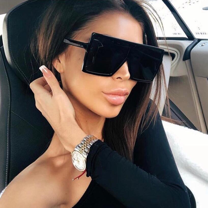 Oversized modern luxury square women's UV400 sunglasses by Stevvex with black frames and tinted lenses.