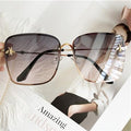 Stevvex oversized square UV400 sunglasses with black frames and dark tinted lenses, stylish and protective eyewear for sunny days.