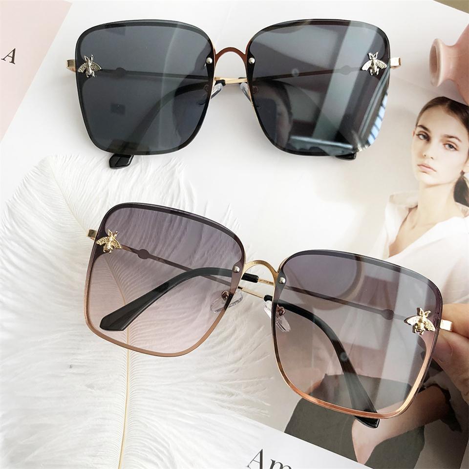 Stevvex oversized square UV400 sunglasses with black frames and dark tinted lenses, stylishly displayed in the image.