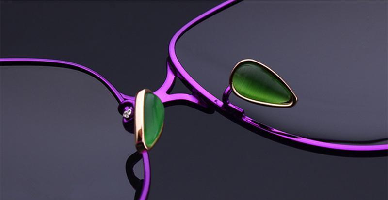 Elegant Stevvex polarized luxury women's sunglasses with sleek design and tinted lenses, showcased on a stand.