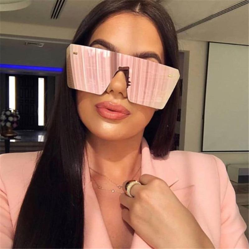 Modern oversized square UV400 sunglasses by Stevvex with black frames and dark tinted lenses.