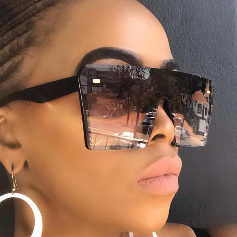 Modern oversized square UV400 sunglasses by Stevvex with black frames and dark tinted lenses for stylish sun protection