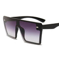 Stylish oversized square UV400 sunglasses by Stevvex with black frames and dark tinted lenses, perfect for modern fashion.