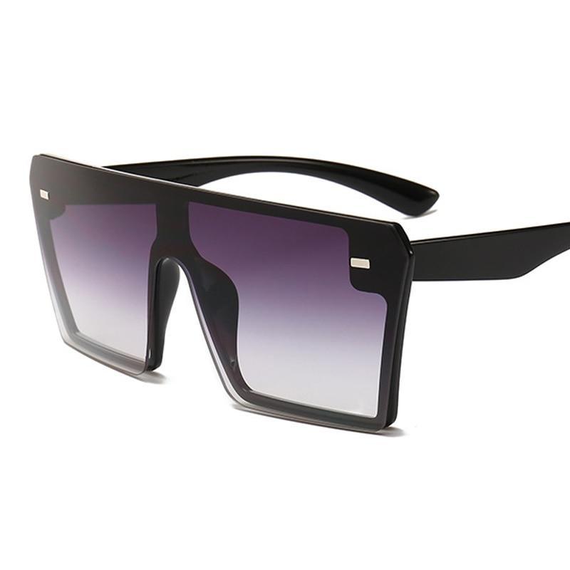 Stylish oversized square UV400 sunglasses by Stevvex with black frames and dark tinted lenses, perfect for modern fashion.