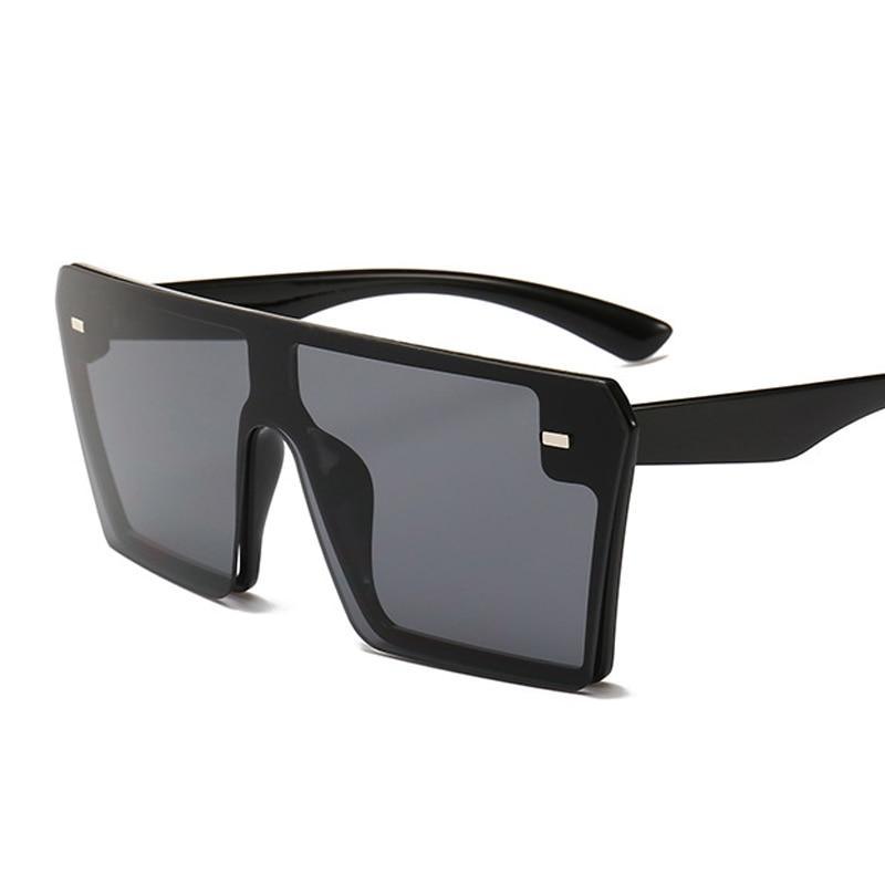 Modern oversized square sunglasses by Stevvex with UV400 protection, featuring dark tinted lenses and bold black frames.
