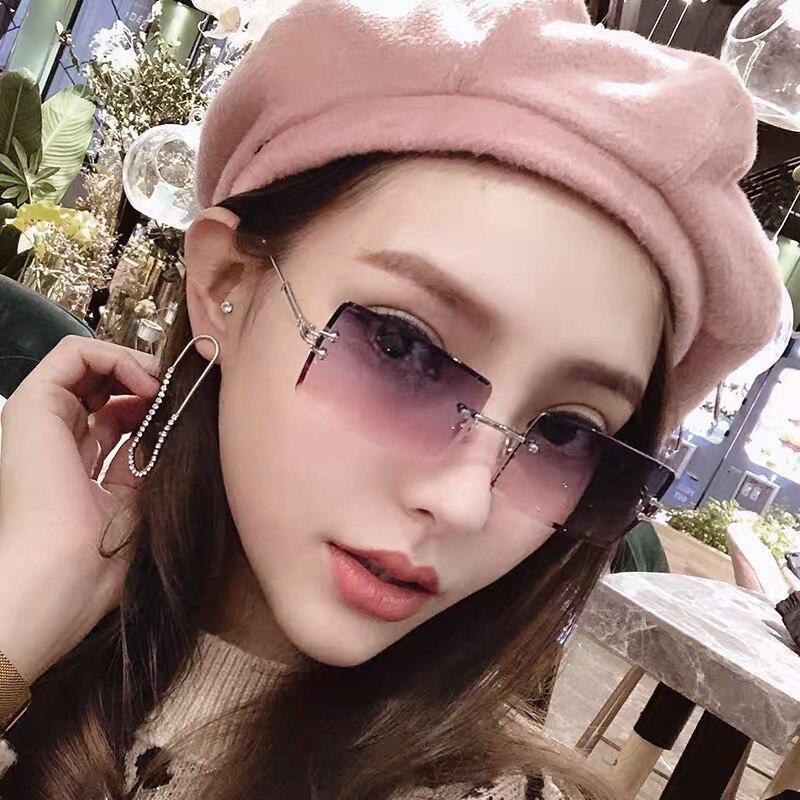 Stevvex fashion rimless rectangle UV400 sunglasses with clear lenses and sleek design, perfect for stylish sun protection.