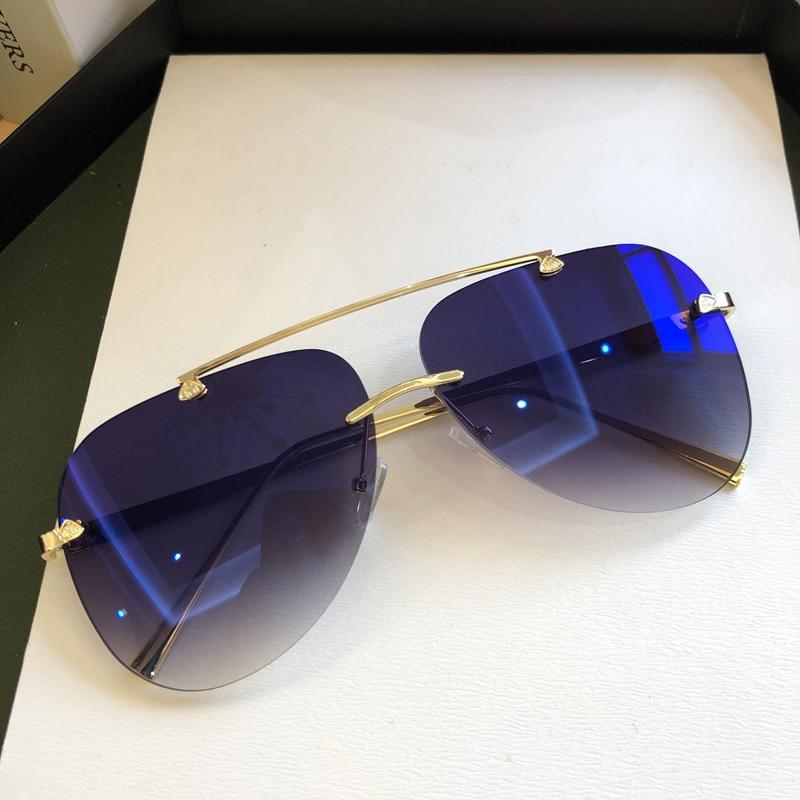 Stevvex metal rimless UV protected gradient sunglasses with sleek design and tinted lenses for stylish sun protection.