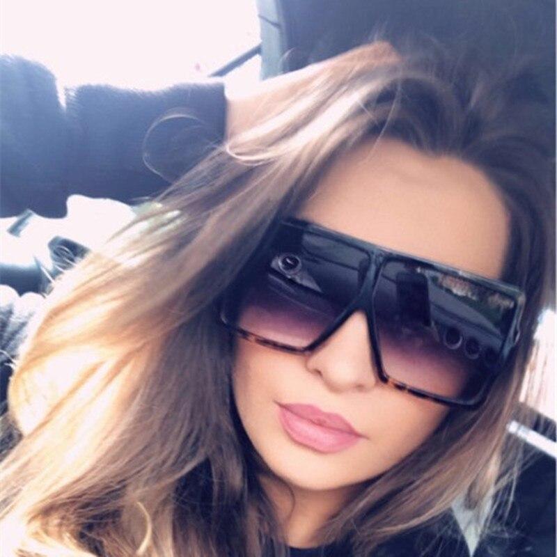 Stevvex oversized modern luxury square women's UV400 sunglasses with black frames and dark tinted lenses.