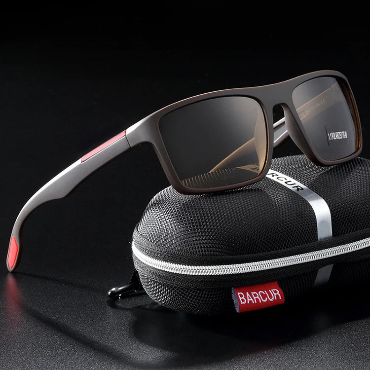 Stevvex BARCUR TR90 ultralight polarized UV400 sunglasses with black frame and tinted lenses, resting on a wooden surface.