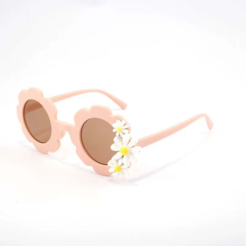 Kids' retro flower-shaped sunglasses by ozznekshoes with colorful daisy bloom design, perfect for stylish sun protection.