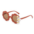 Kid's retro flower-shaped sunglasses with colorful Daisy Bloom design by ozznekshoes, featuring playful floral frames.