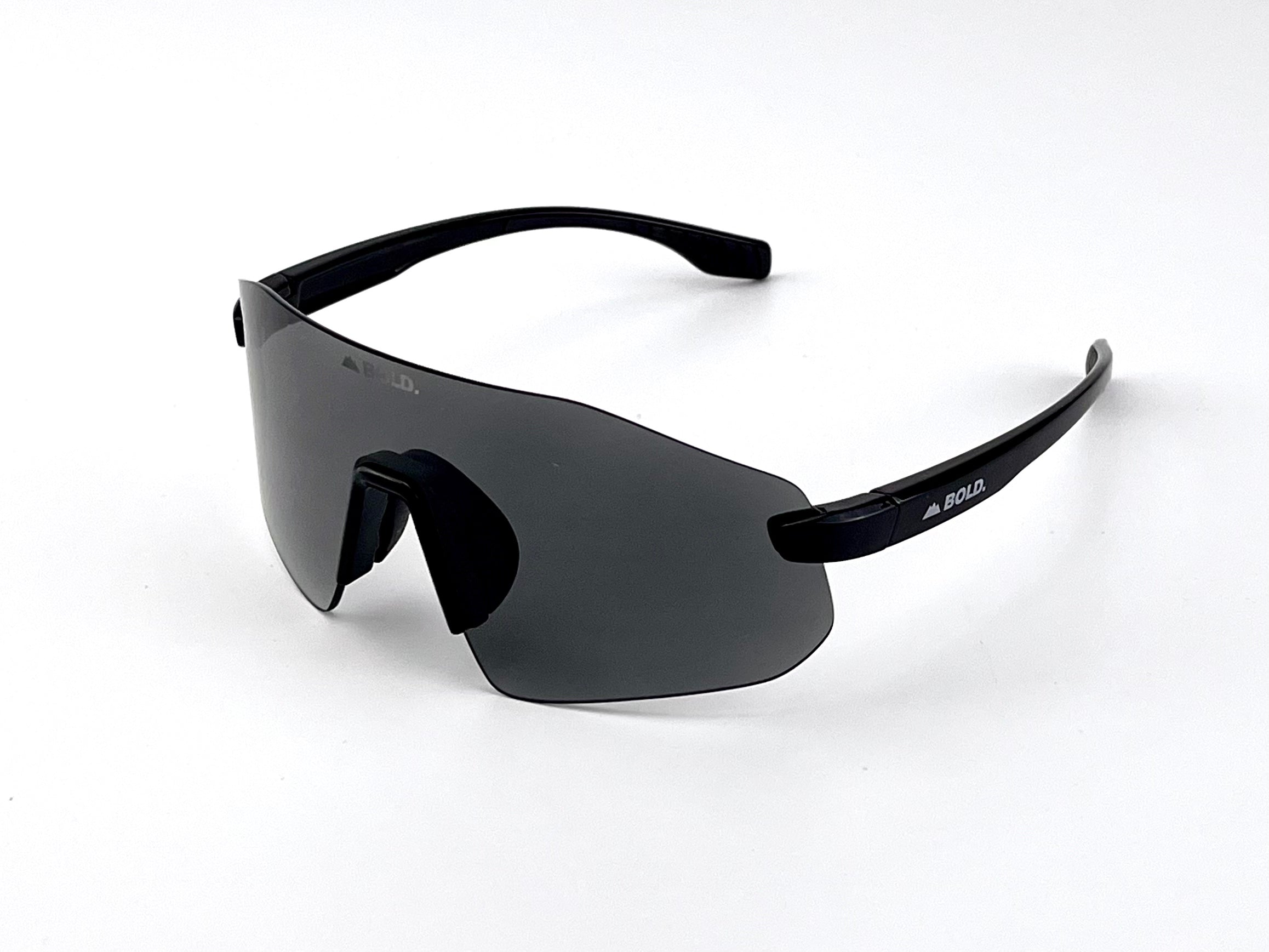 Boldouterwear BOLD Emerald Photochromic sunglasses with green-tinted lenses, outdoor eyewear designed for versatile sun protection.