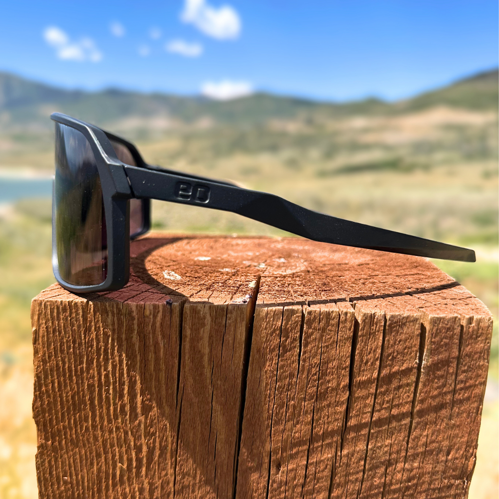 Eastern Outer Kamas photochromic mountain bike sunglasses shown from outside profile, featuring sleek frame and tinted lenses.