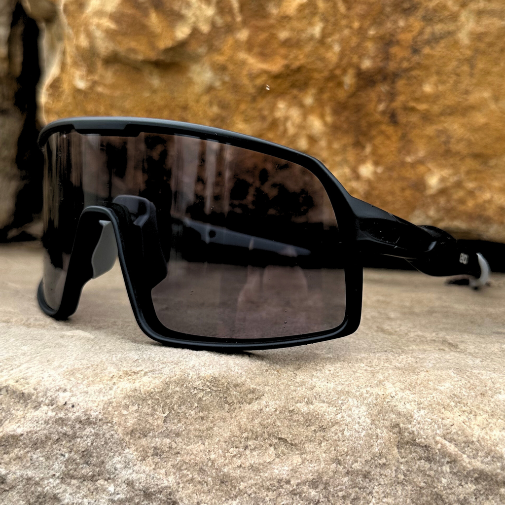 Eastern Outer Mojave sunglasses with photochromic lenses, shown from an outside angle in black frame style.