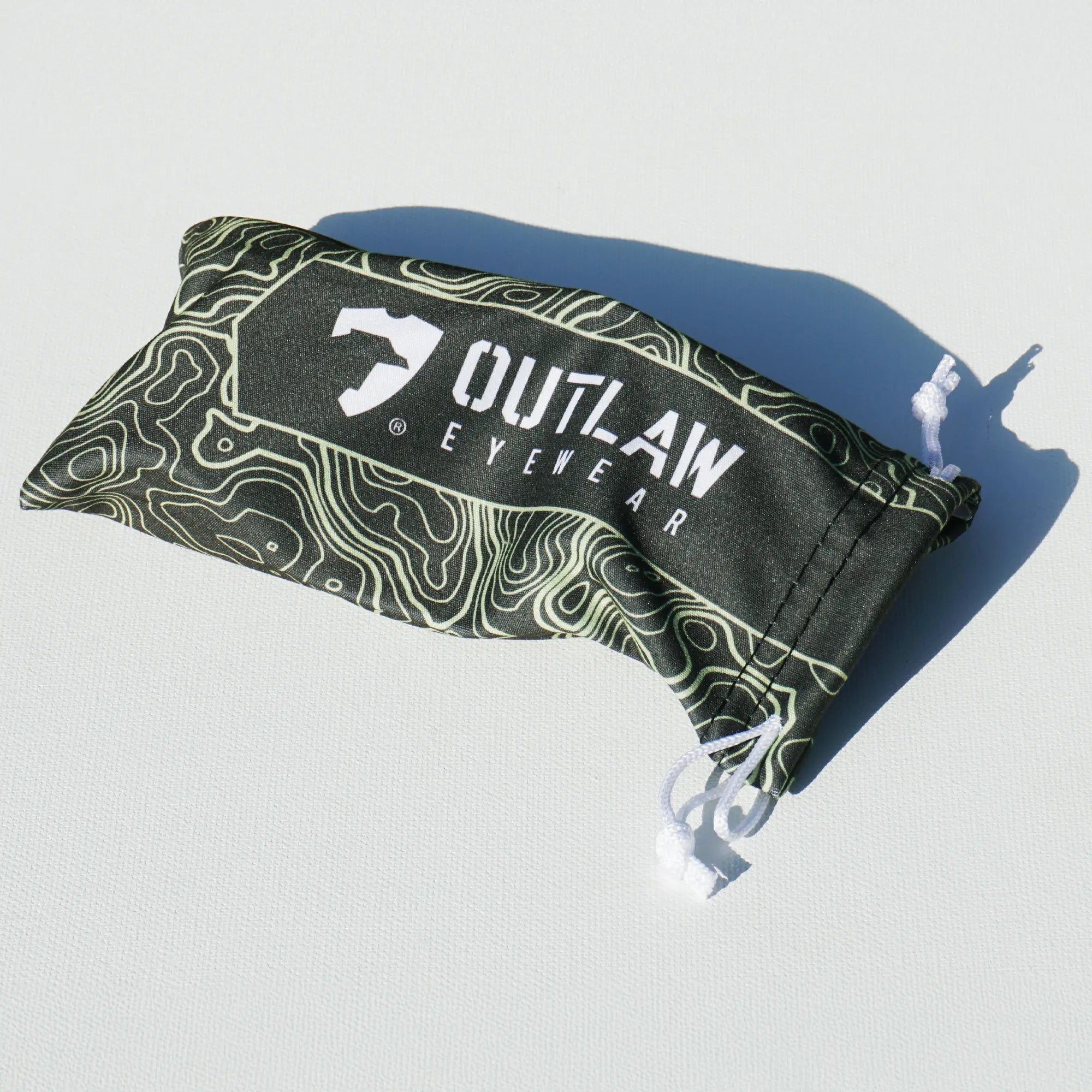 OutLaw Eyewear NVG camo glasses cleaning pouch with soft interior, designed for protecting and cleaning eyewear accessories.