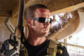 OutLaw Eyewear Fugitive TAC military polarized sunglasses with black frame and gray lenses, outdoor scene background