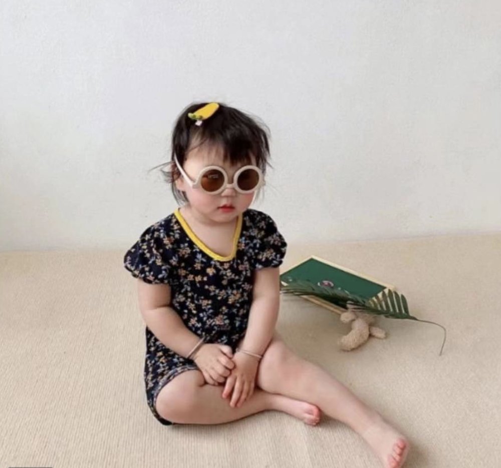 Round vintage style kids sunglasses by ozznekshoes, featuring colorful frames and tinted lenses for a playful outdoor look.
