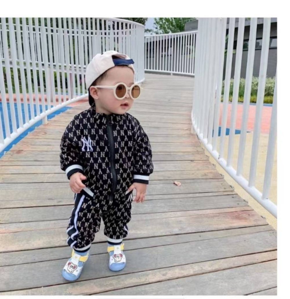 Round vintage style kids sunglasses by ozznekshoes with dark tinted lenses and colorful frame for playful summer wear.