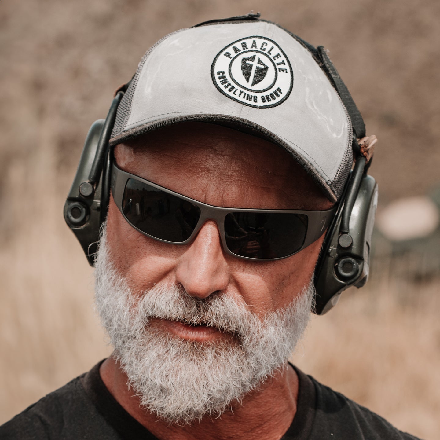 OutLaw Eyewear Fugitive TAC sunglasses with brushed gunmetal frame and polarized lenses, ANSI Z87.1-2015 rated for safety.