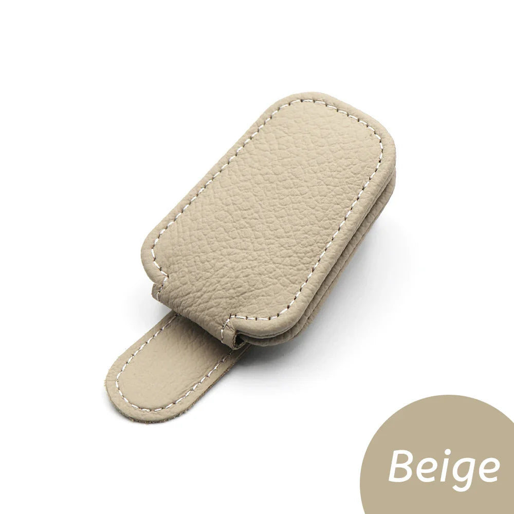 Econic Blanks universal car sun visor sunglasses clip holding sunglasses on a car sun visor. Eyewear accessories for convenient storage.
