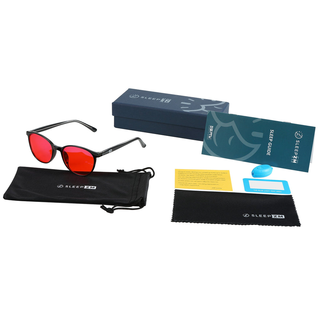 Blue Light Glasses by Sleep ZM for kids, black frame with red-tinted lenses, designed to block blue light during nighttime use.