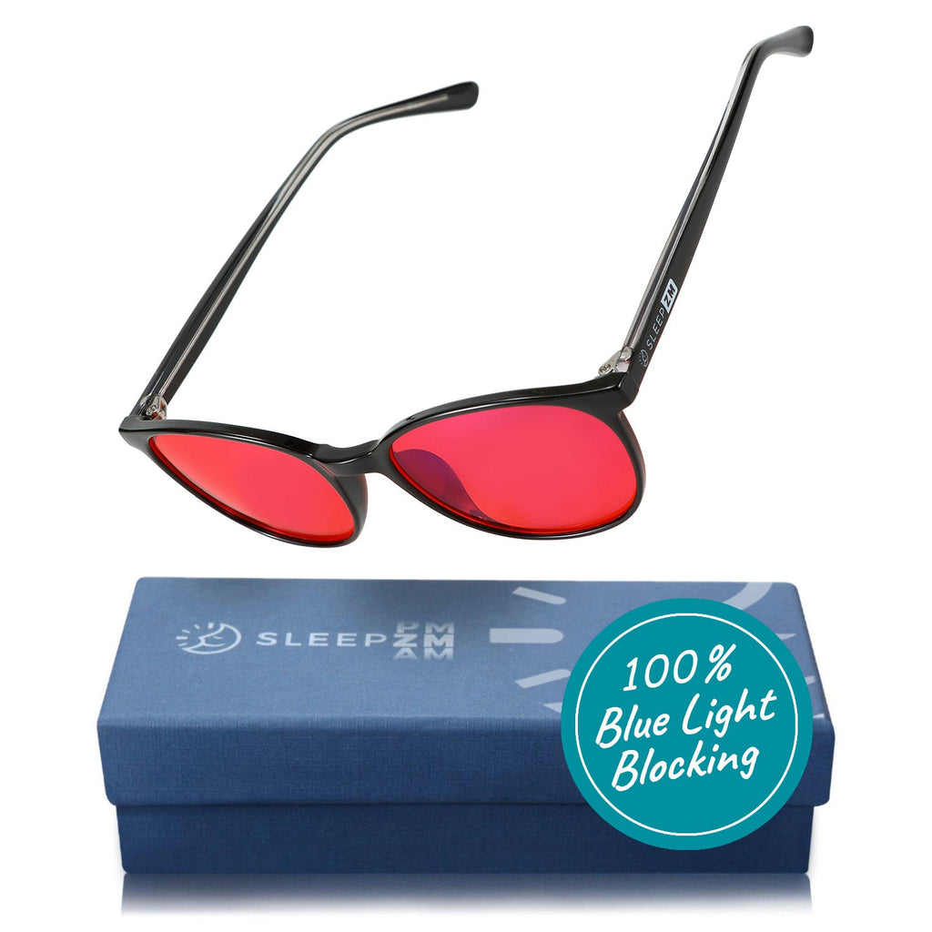 Taylor Kids blue light blocking glasses by Sleep ZM with black frames and red-tinted lenses for nighttime screen protection.