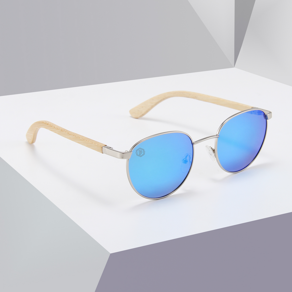 Papago Azule Onofres sunglasses with white recycled wooden frames displayed on a shelf. Handmade eco-friendly eyewear.