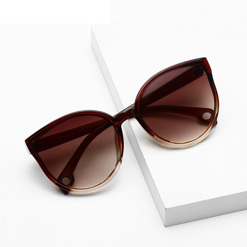 Large cat eye sunglasses by Stevvex with UV400 protection, featuring bold black frames and tinted lenses for women.