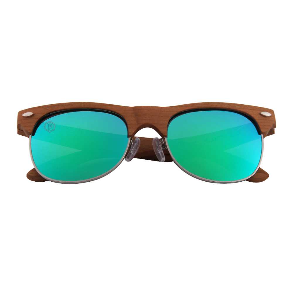 Papago Turquoise Canyons handmade wooden sunglasses with turquoise accents, shown laying down, eco-friendly and stylish eyewear.