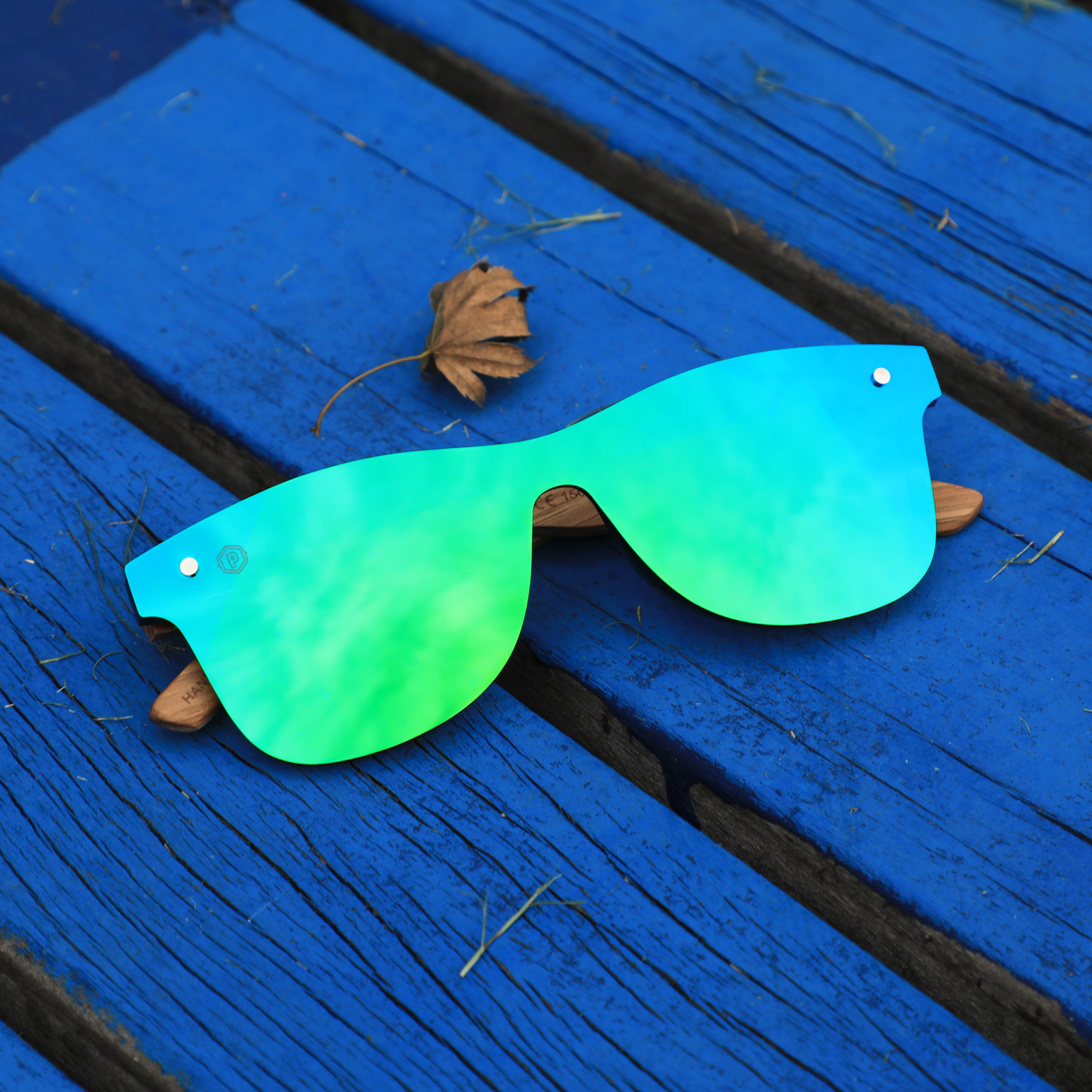 Pair of Cerulean Ventures blue wooden sunglasses by Papago, handcrafted from recycled wood with a stylish, natural finish.