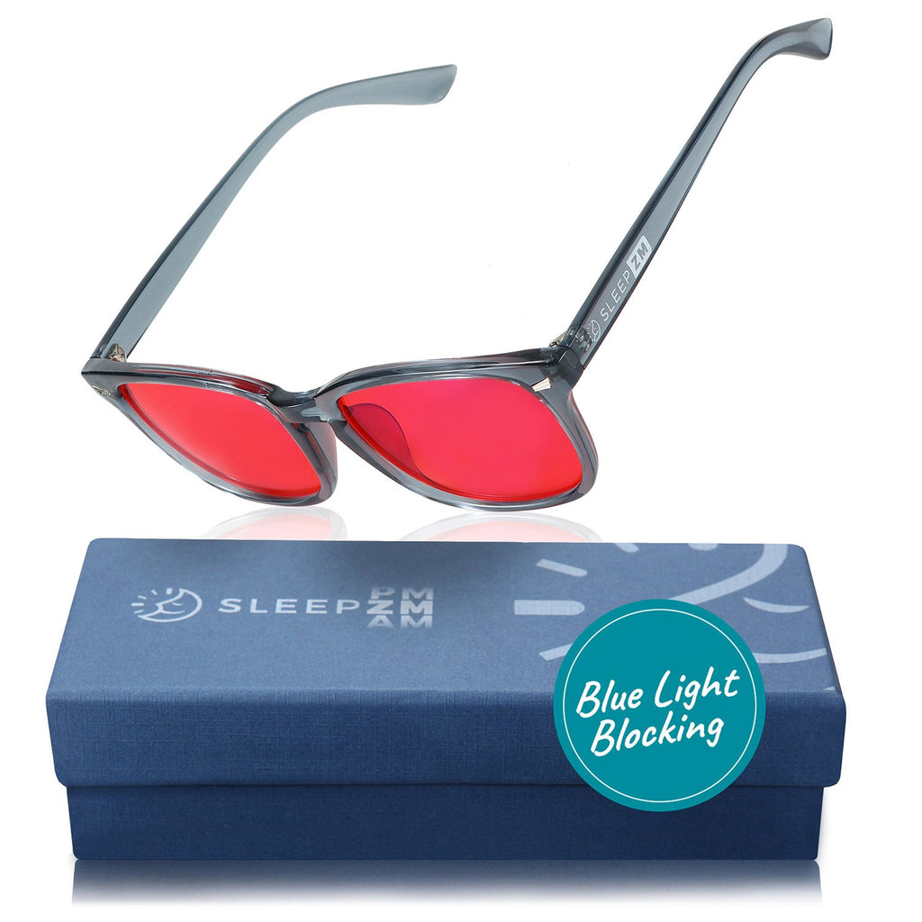 Blue Light Glasses by Sleep ZM with translucent blue frame and red-tinted lenses, designed for night-time use.