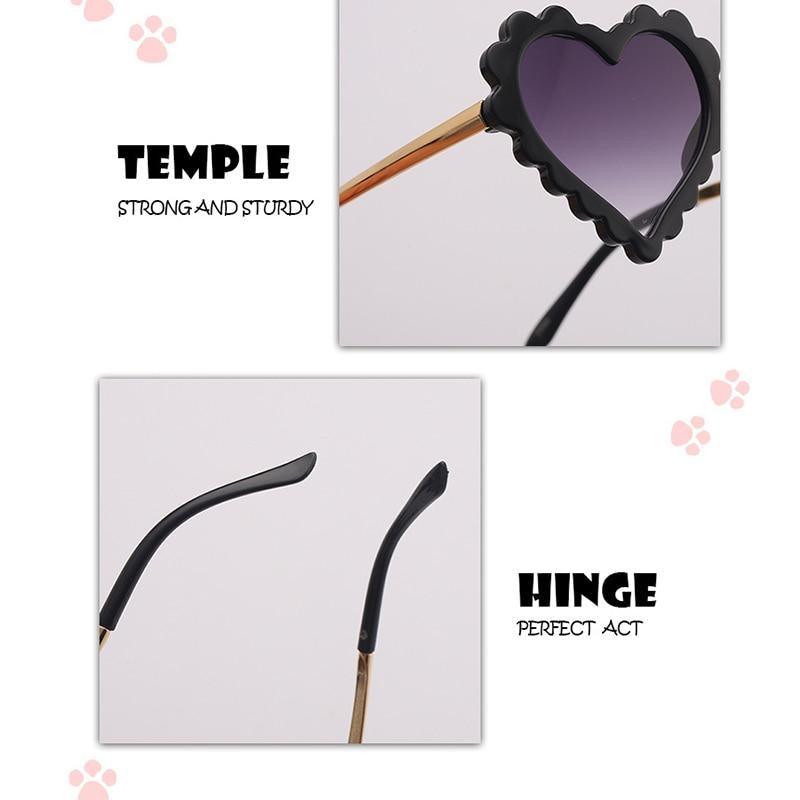 Kids' heart-shaped sunglasses by Stevvex with oversized pink frames, floral accents, and UV protection for children.