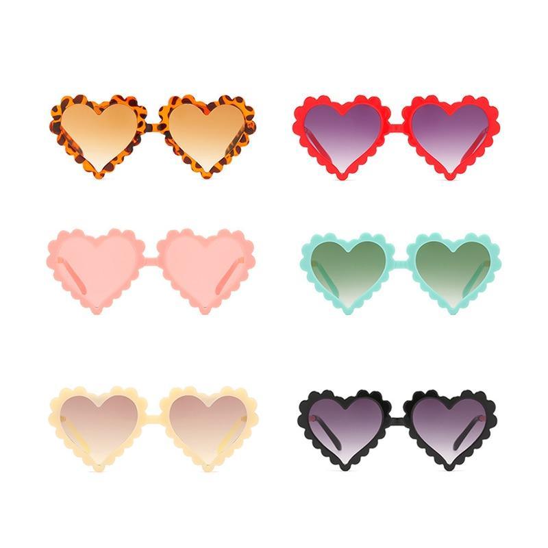 Kids heart-shaped sunglasses by Stevvex with floral details, oversized design, and UV protection, perfect for fashionable little ones.