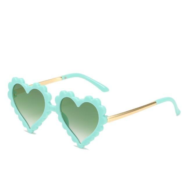 Cute heart-shaped kids sunglasses by Stevvex with floral design, oversized frame, and UV protection for children.