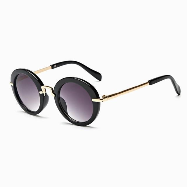 Cute round Stevvex kids' sunglasses with colorful frames, UV400 protection, polarized lenses, and a fashionable child-friendly design.