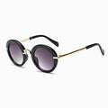 Cute round Stevvex kids' sunglasses with colorful frames, UV400 protection, polarized lenses, and a fashionable child-friendly design.