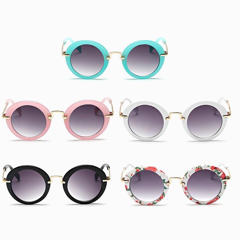 Cute round kids' sunglasses by Stevvex with colorful frames, UV400 protection, and polarized lenses for girls and boys.