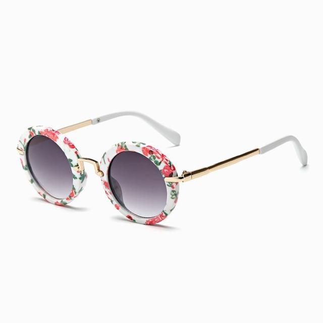 Cute round kids' sunglasses by Stevvex with colorful frames, UV400 protection, and polarized lenses for boys and girls.