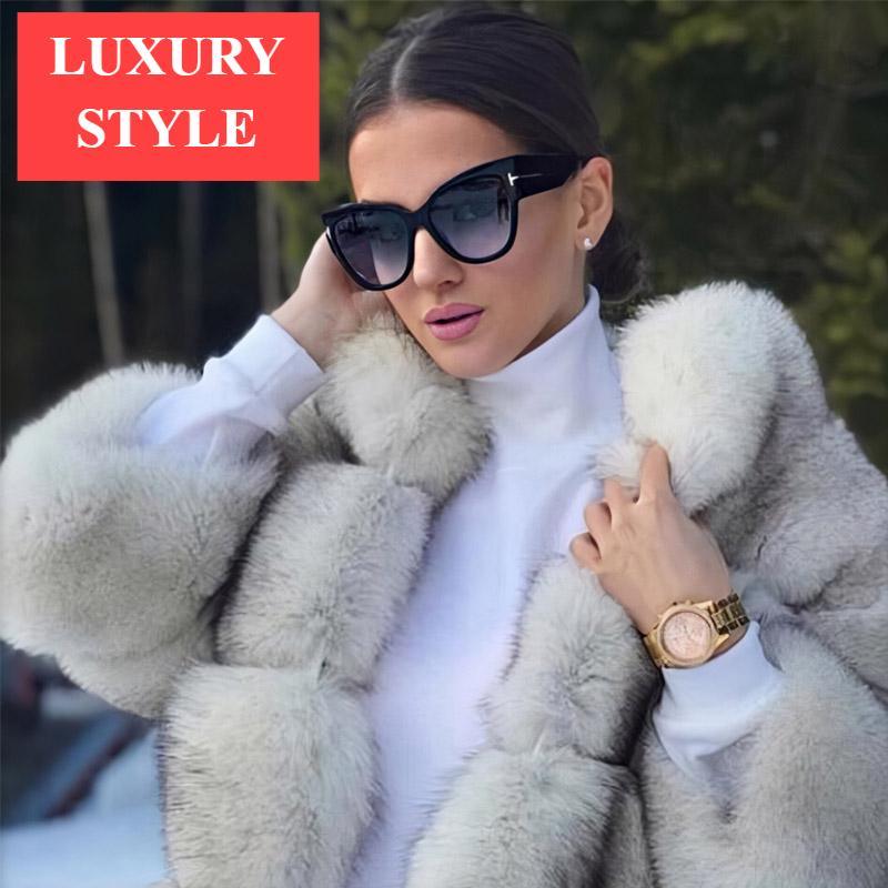 Stevvex oversized cat eye polarized UV400 sunglasses for women with black frames and dark tinted lenses.