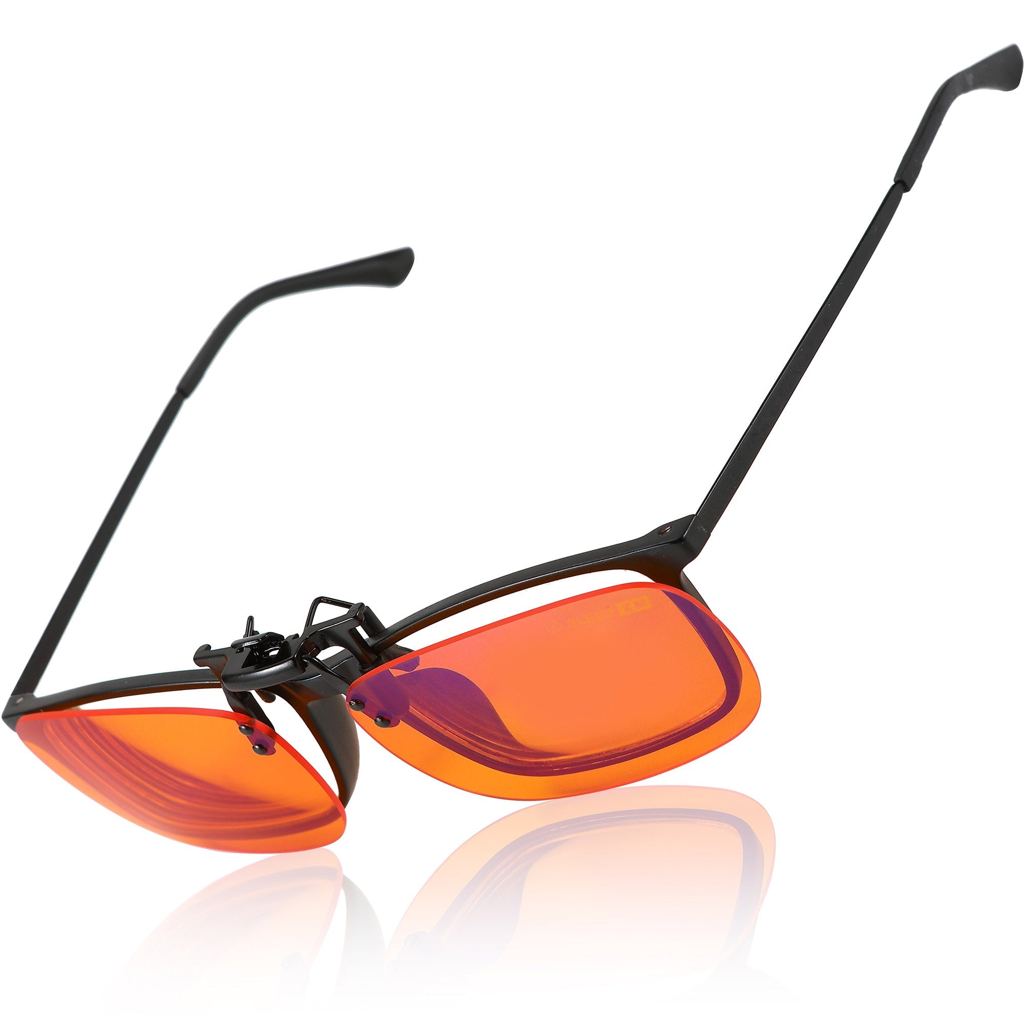Blue Light Glasses by Sleep ZM with flip-up clip-on design and orange-tinted lenses for blocking blue light during night-time use.