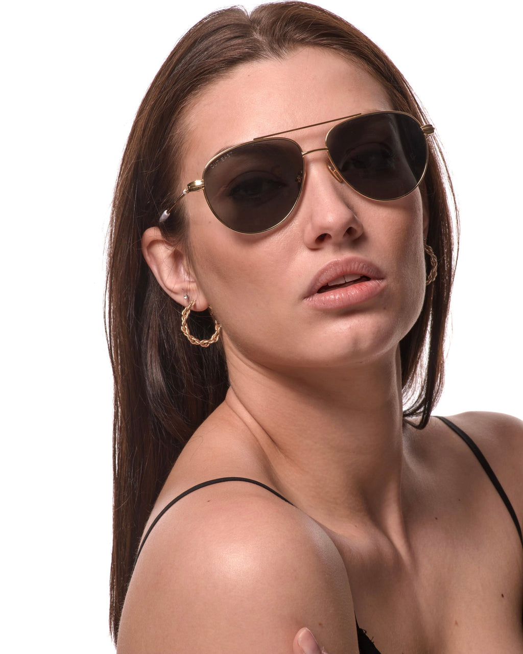 Out East Eyewear Gansett sunglasses with black frames and tinted lenses, resting on a wooden surface.